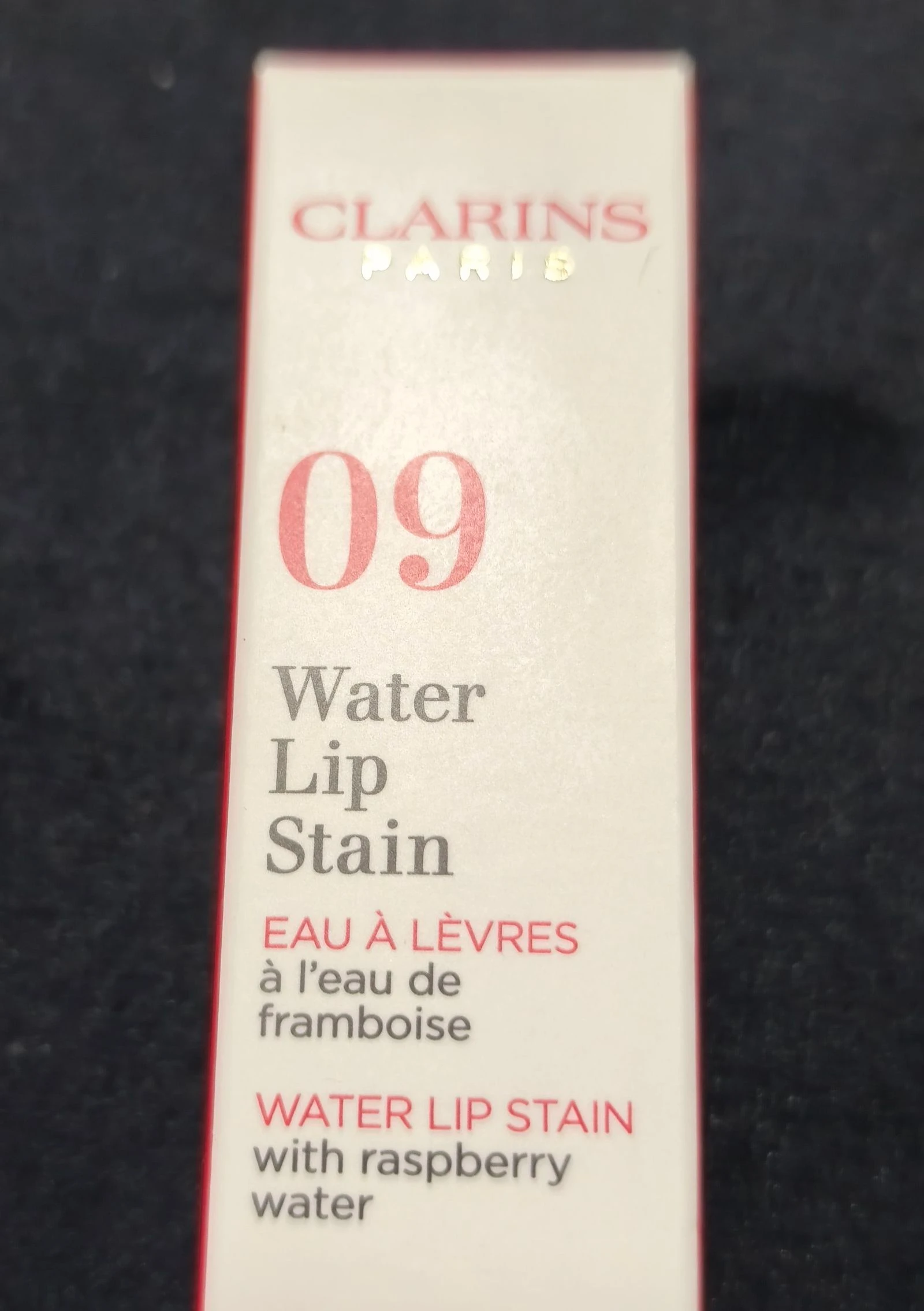 Neceser com batom da Clarins e cremes. – photo 6